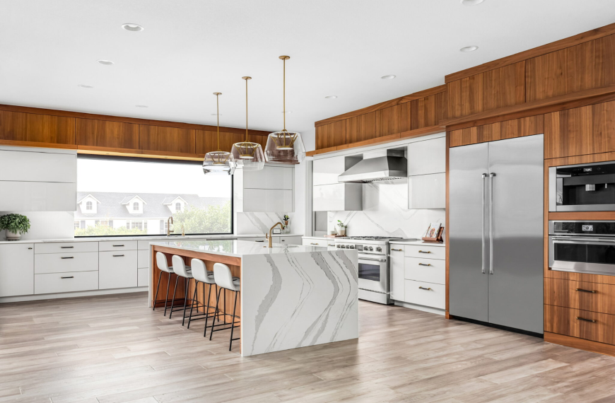 Stylish kitchen with wood cabinets and sleek countertops.